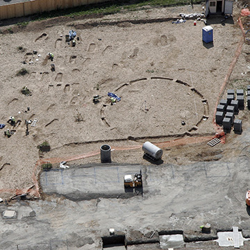 Aerial photograph of the 2008 excavation site showing the Anglo-Saxon graves and a late Neolithic/early Bronze Age ring-ditch, looking south-west.