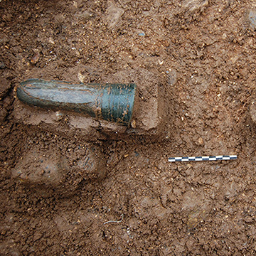 The glass cone beakers in situ within the grave (Scale 10cm)